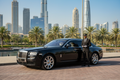 black luxury sedan with driver in dubai of alalali tahir tours